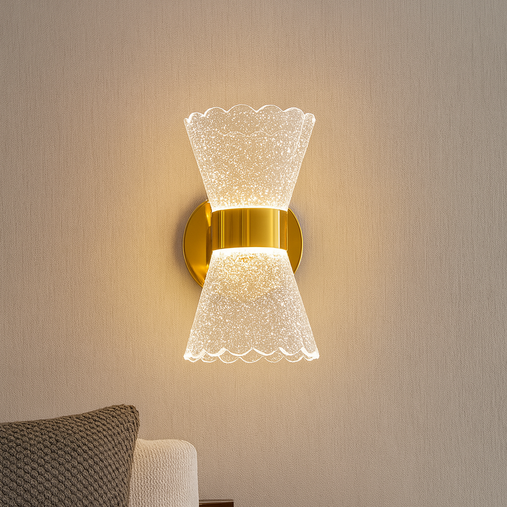 Decorative wall sconce with a gold finish in a bedroom setting.