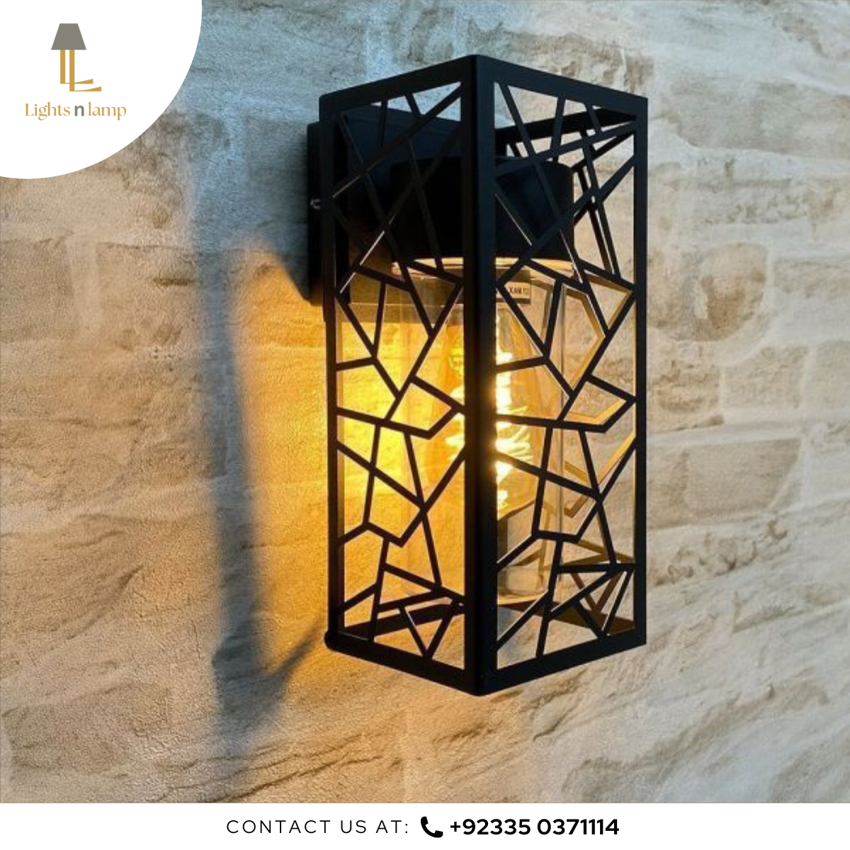 Decorative wall light fixture on a stone wall with 'Lights n Lamp' branding.