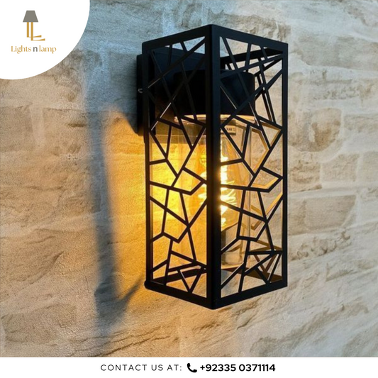 Decorative wall light fixture on a stone wall with 'Lights n Lamp' branding.