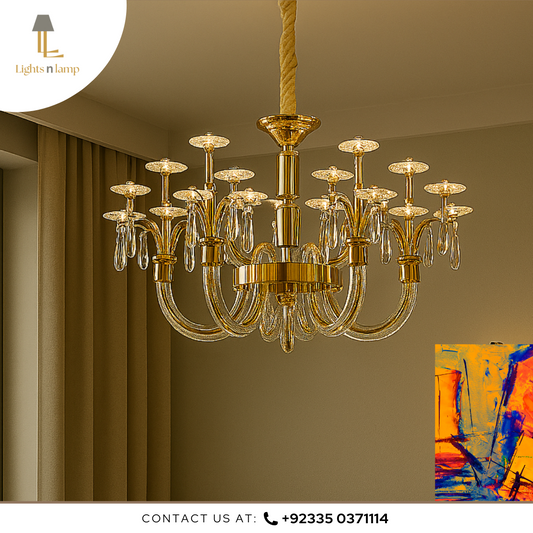 Gold chandelier hanging in a room with a painting on the wall.