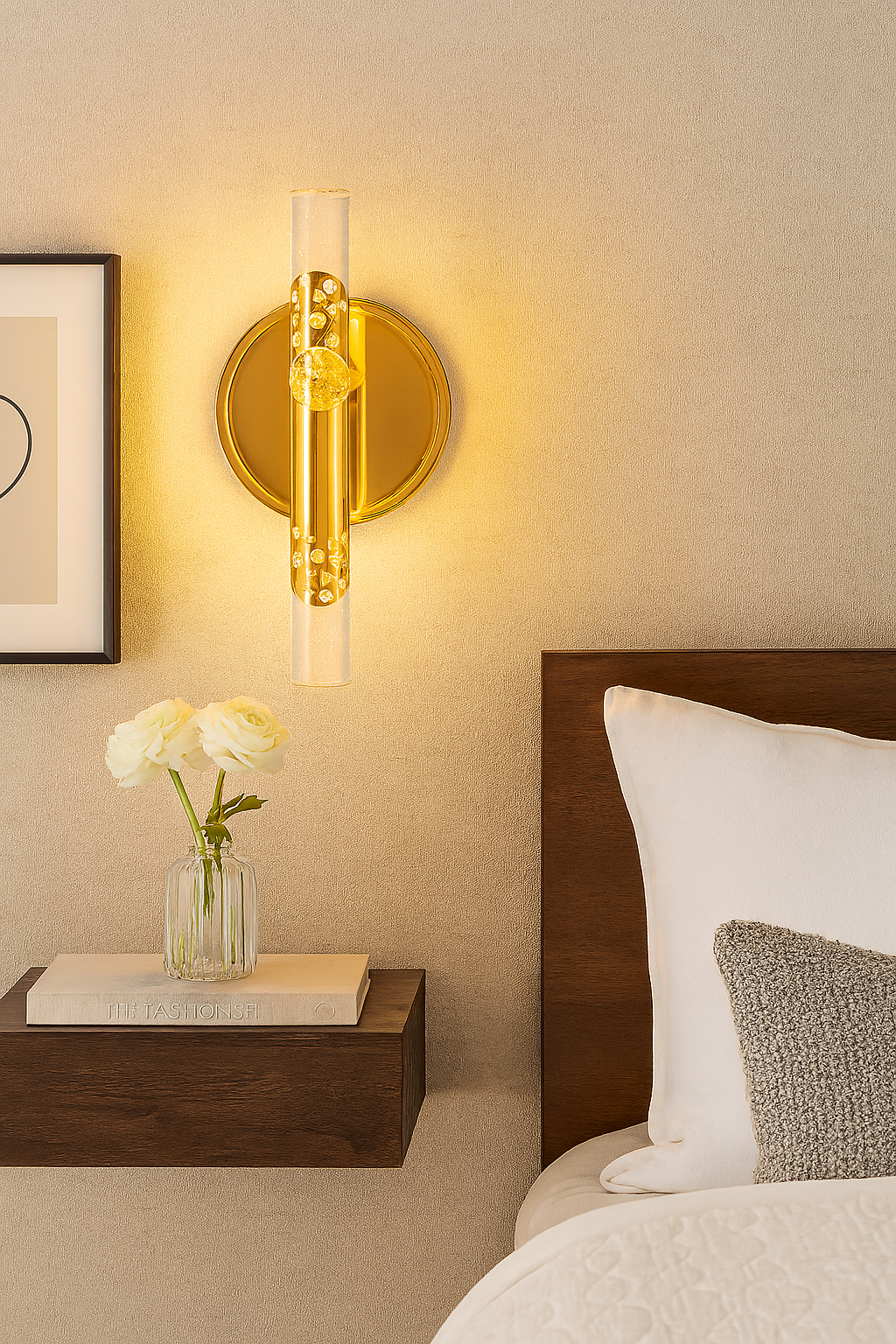 Decorative wall sconce with a gold finish in a bedroom setting.