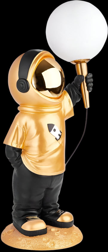 Gold astronaut figurine holding a white light bulb