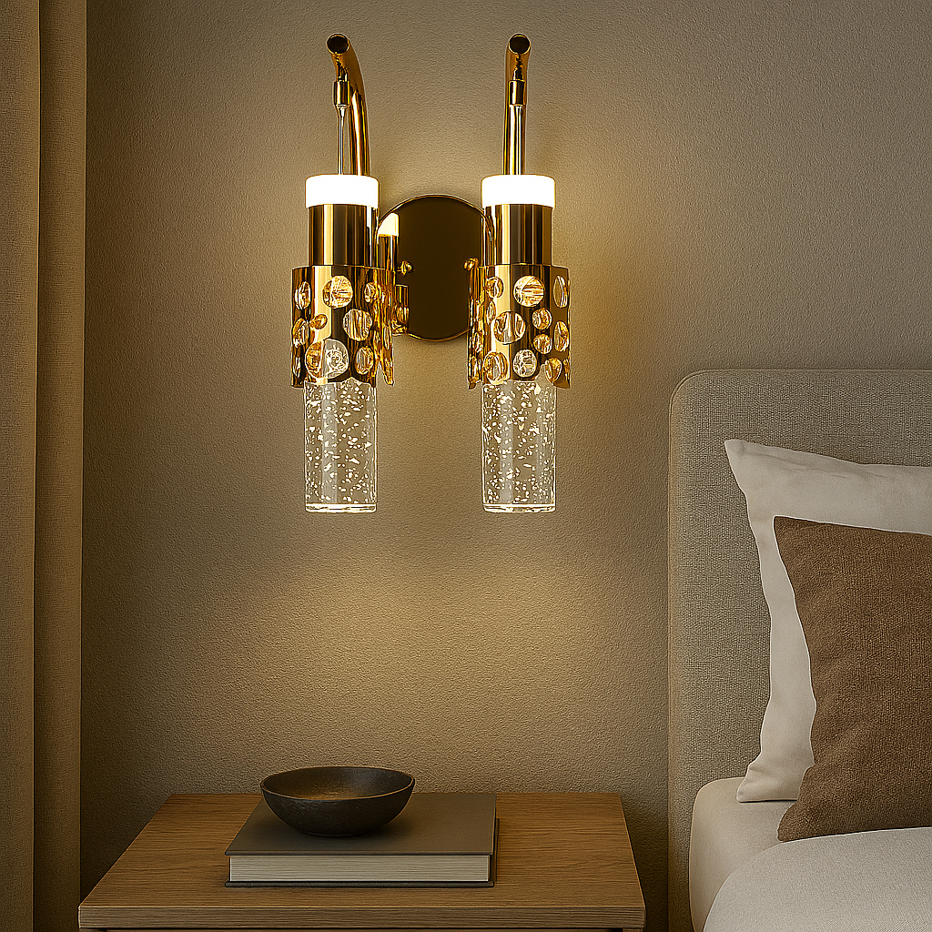 Decorative wall sconces above a bedside table with a book and bowl in a bedroom setting.