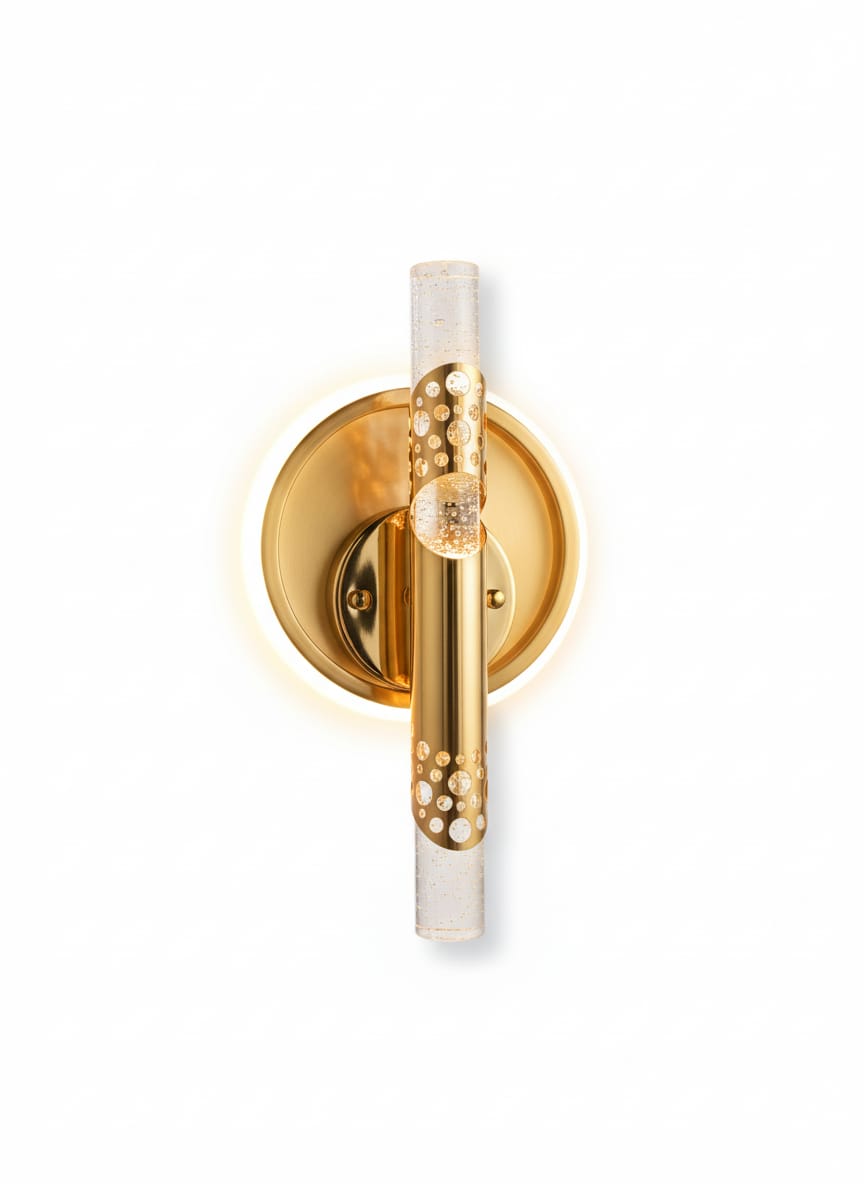 Gold wall sconce with decorative design on a white background