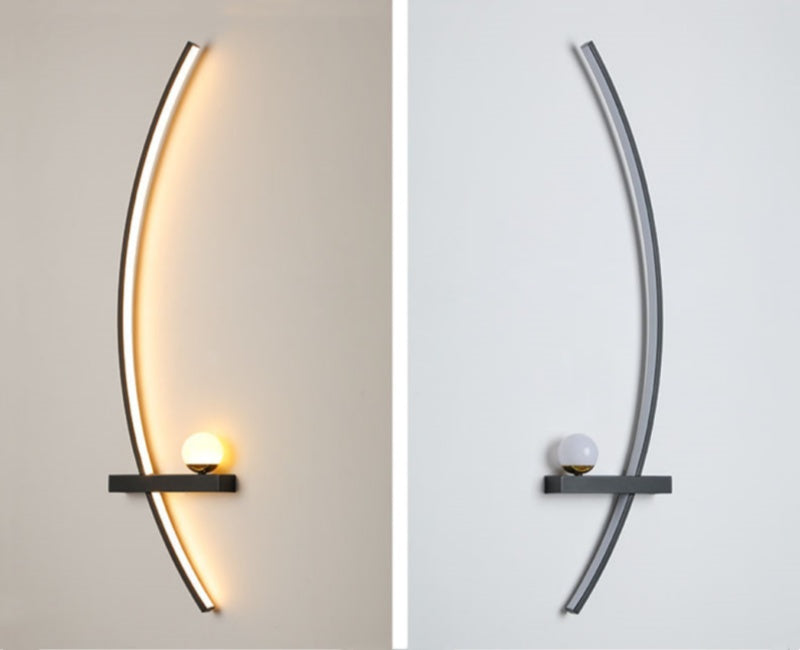 Modern wall sconce with curved design on a neutral background