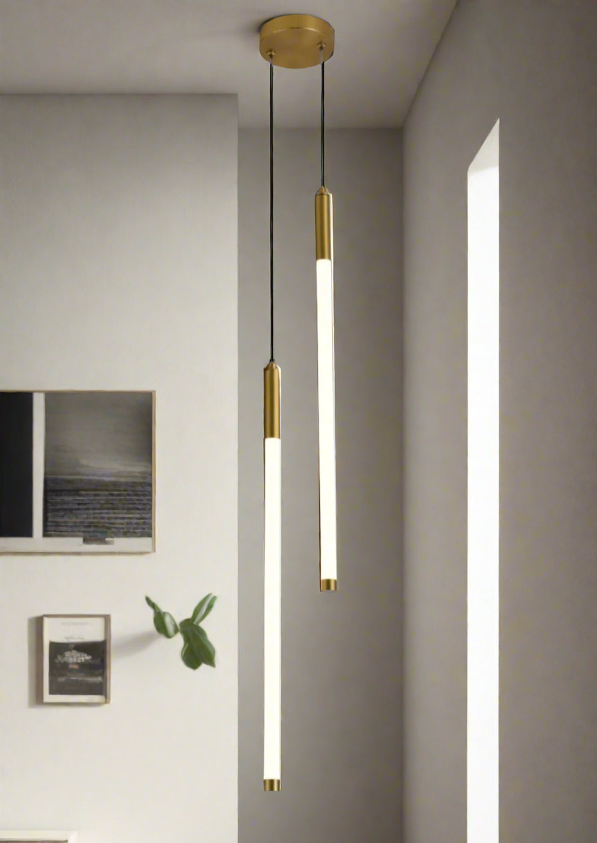 Modern pendant light fixture hanging in a room with neutral walls and decor.