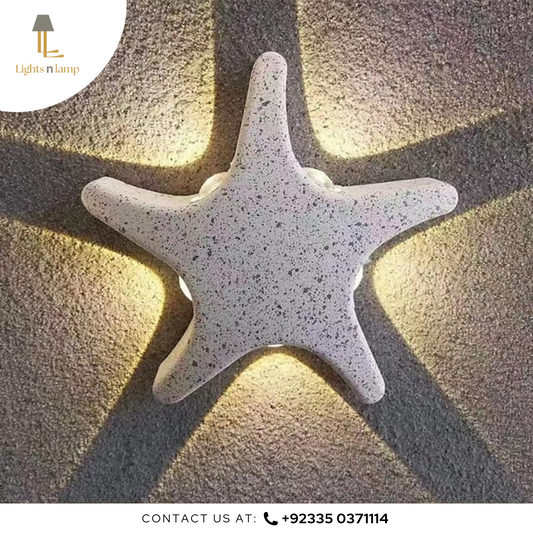 Star-shaped wall light fixture on a textured wall with 'Lights n Lamp' branding.