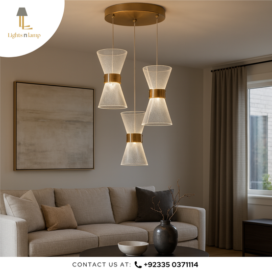 Modern living room with a stylish pendant light fixture, sofa, and decor elements.