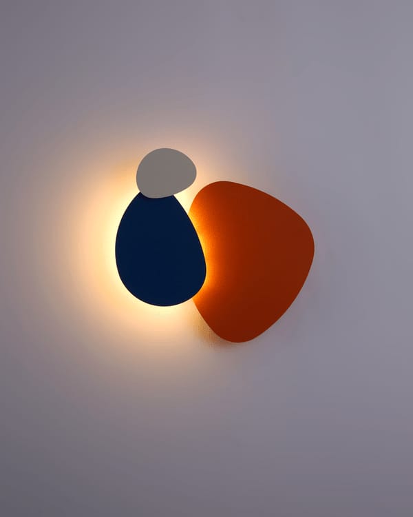 Modern wall light fixture with two colorful, abstract shapes on a plain background