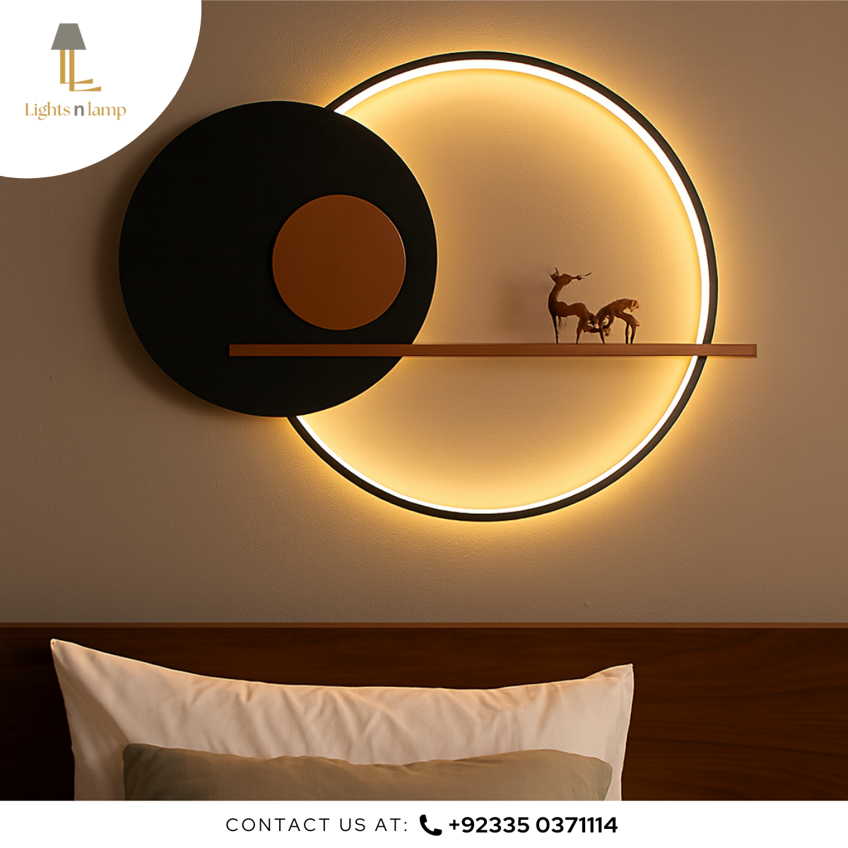 Modern wall light fixture with circular design on a wall, featuring a shelf and decorative items.