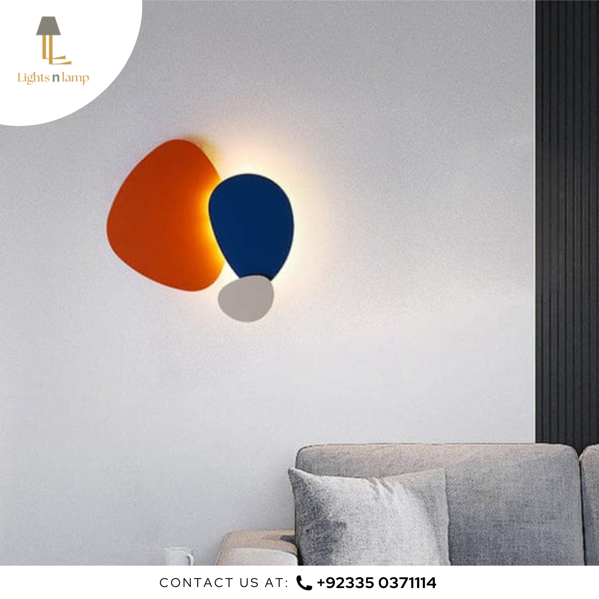 Modern wall light fixture with orange and blue design on a gray wall.