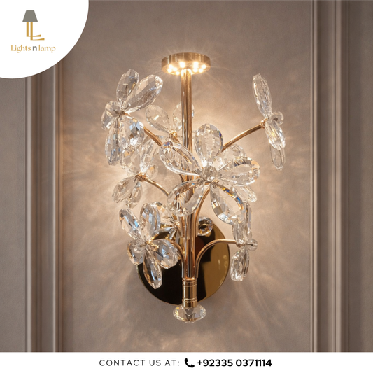 Decorative wall light fixture with crystal accents on a neutral background