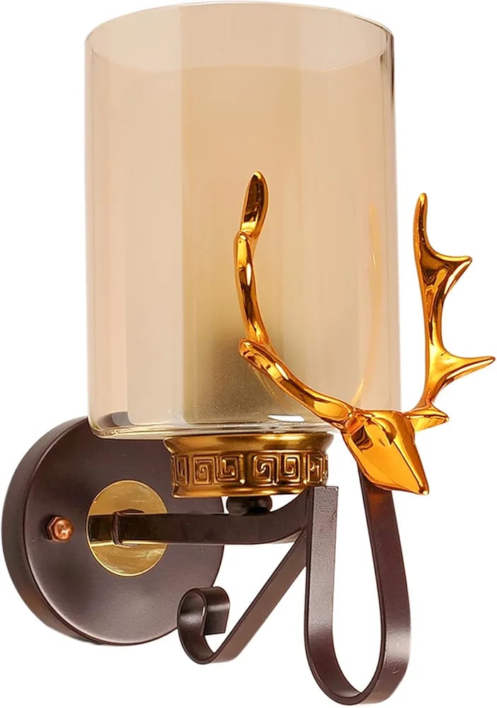 Decorative wall sconce with gold deer head design on a white background