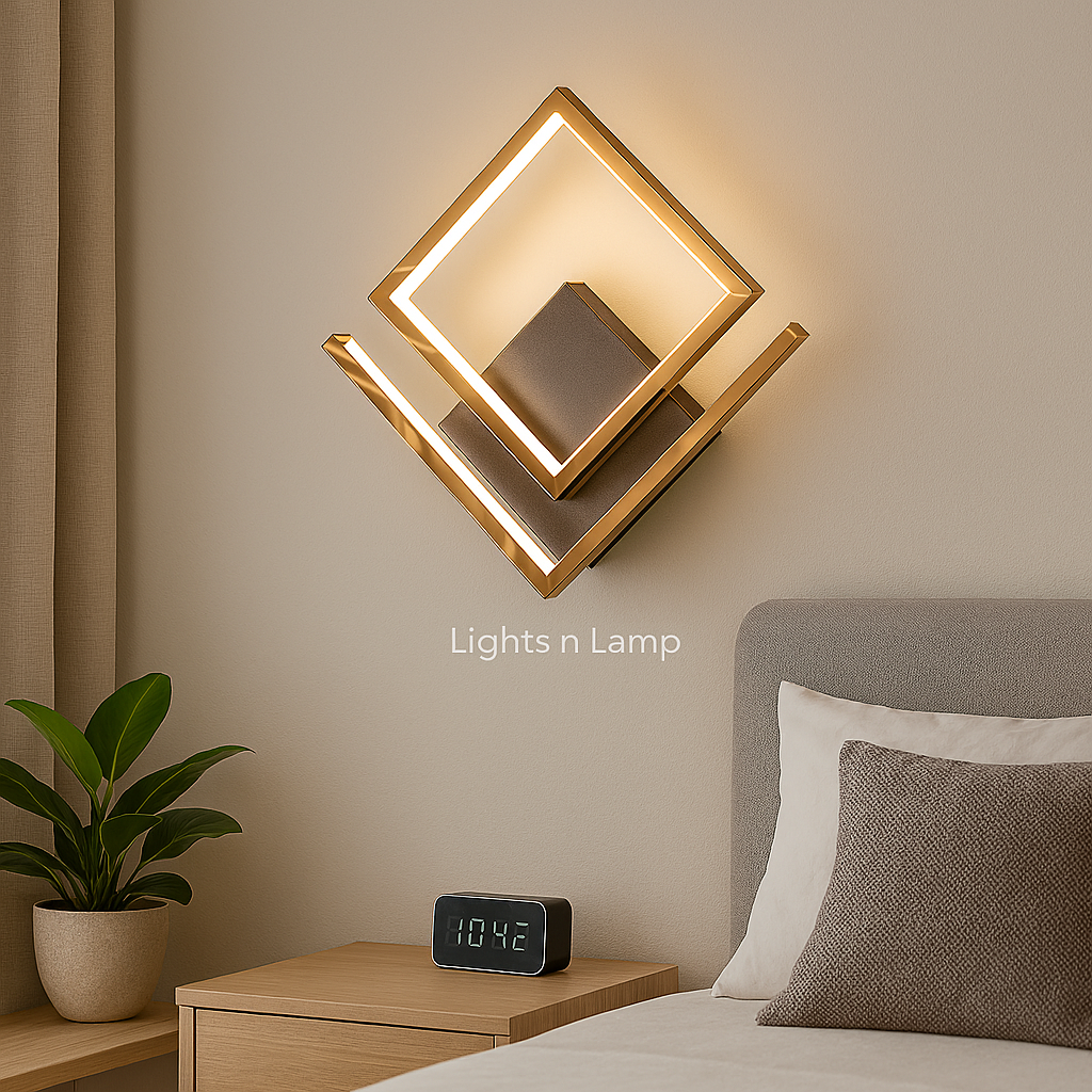 Modern wall light fixture on a wall above a bed with a clock and plant in the foreground.