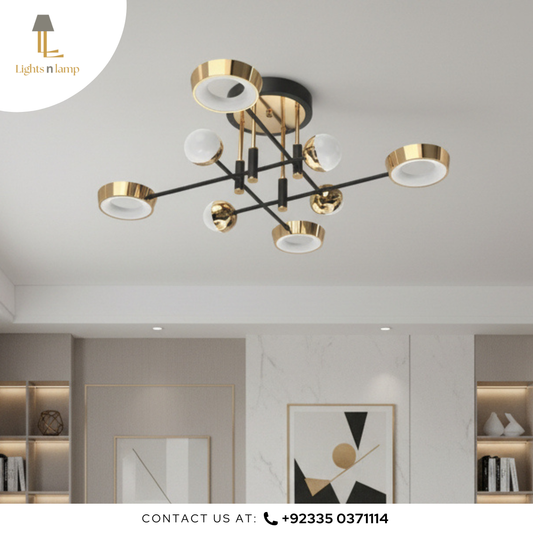 Modern chandelier with gold and black design in a room setting.