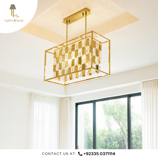 Gold ceiling light fixture in a room with large windows
