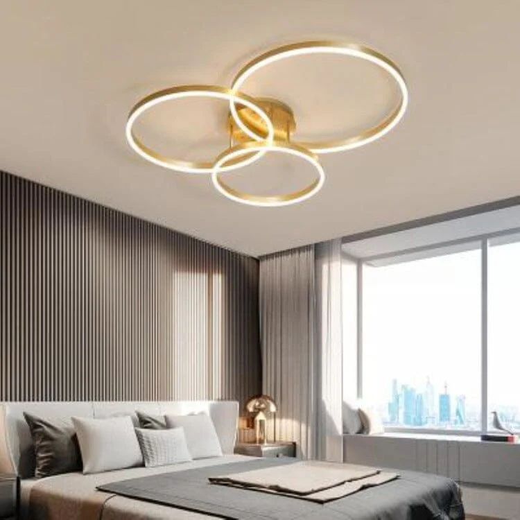 Modern ceiling light fixture in a bedroom with a cityscape view