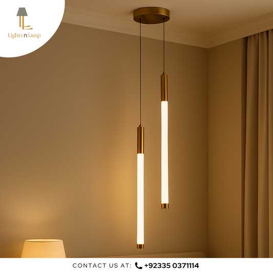 Modern pendant lights hanging in a room with a neutral color scheme.