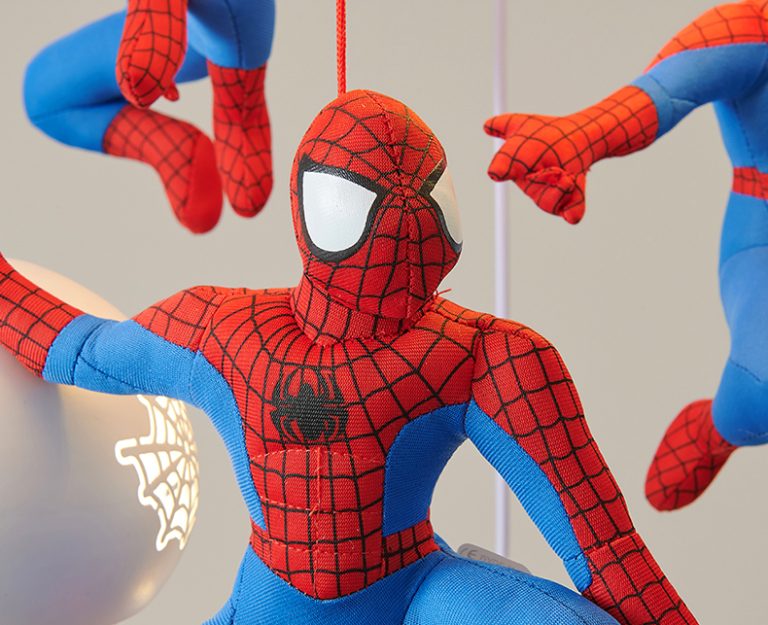 Plush Spider-Man toy in red and blue costume with web design on a neutral background