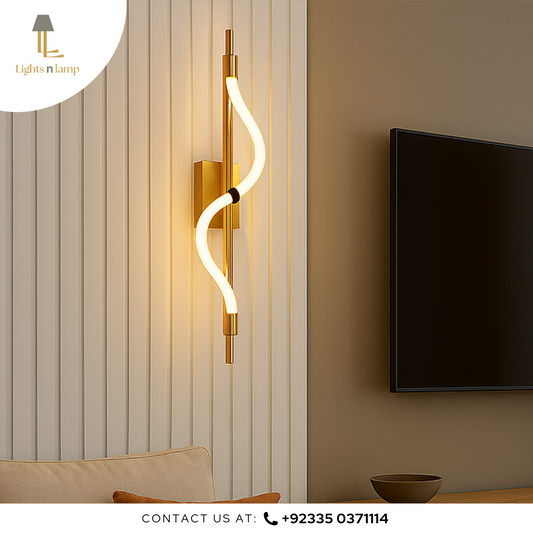 Modern wall-mounted light fixture in a living room setting with a television and decorative elements.