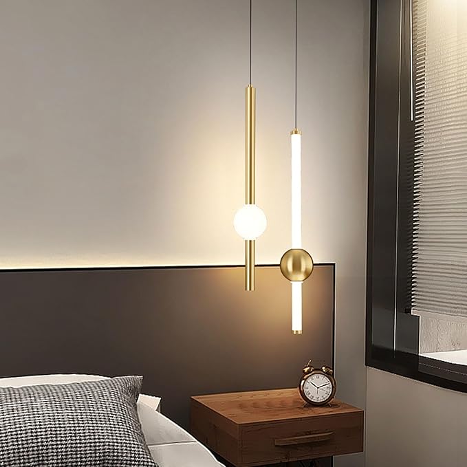Modern bedroom with pendant lights, bed, and nightstand.